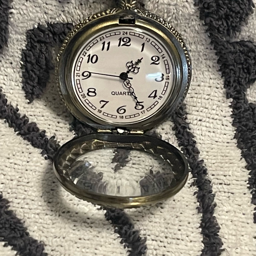 Vintage-style pocket watch photographed for a marketplace listing